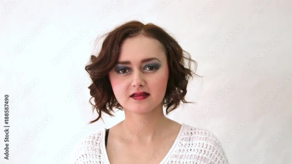 Beautiful fashion model with makeup and short curly hair Beautiful fashion model with makeup and short curly hair