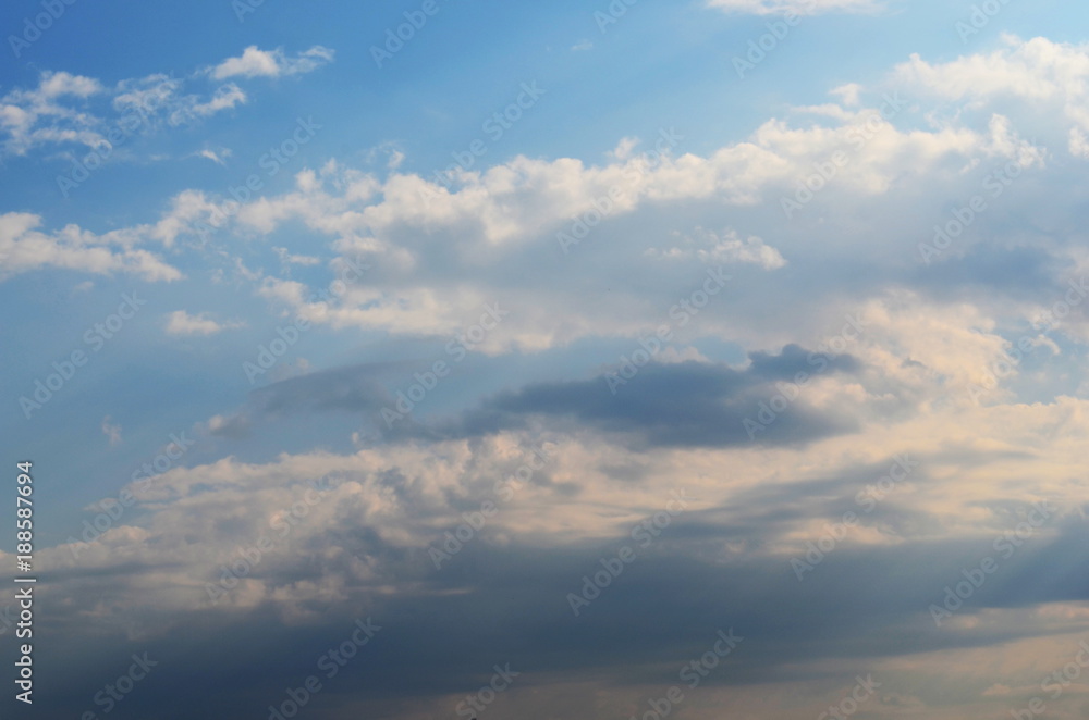 The bright sky. White clouds.