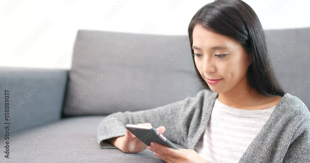 Woman use of cellphone at home
