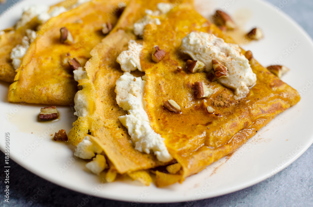 Pumpkin Crepes with Cream Cheese Filling, Pecan and Maple Syrup