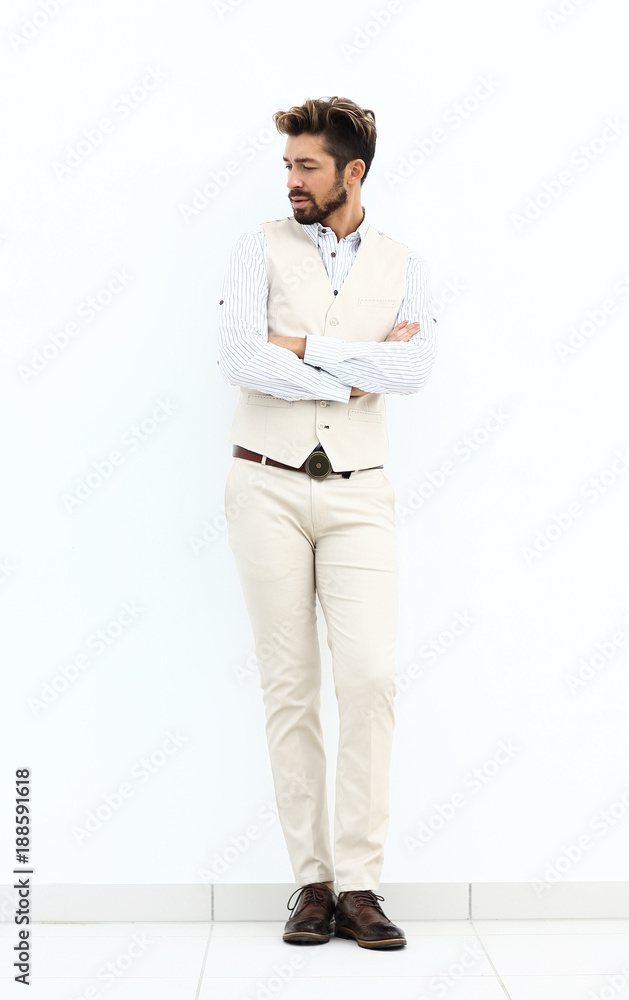 Full length portrait of stylish man with crossed hands Full length portrait of stylish man with crossed hands