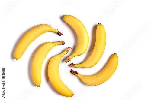 Ripe yellow bananas on a white background