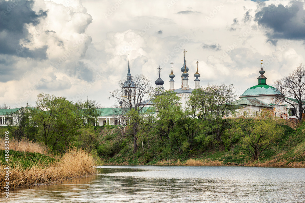 Domes of an Orthodox church in a beautiful summer landscape