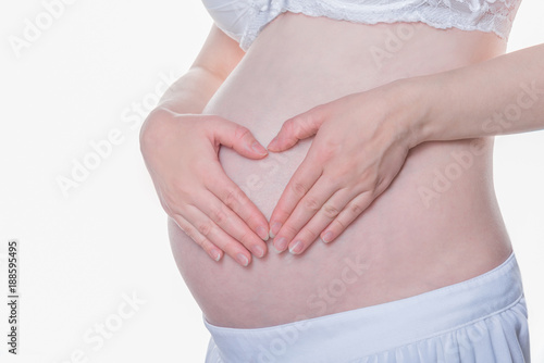 Wallpaper Mural Pregnant woman is pointing at the belly Torontodigital.ca