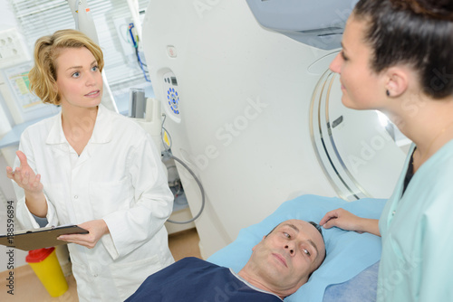 male patient undergoing test at ct scanner machine