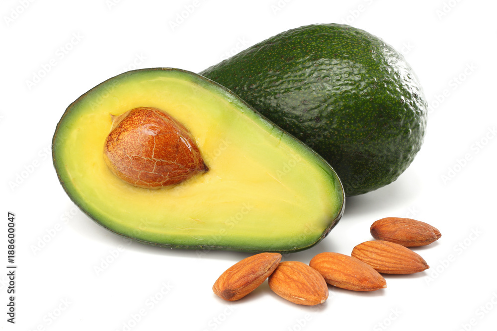 healthy food. sliced avocado with almonds isolated on white background healthy food. sliced avocado with almonds isolated on white background