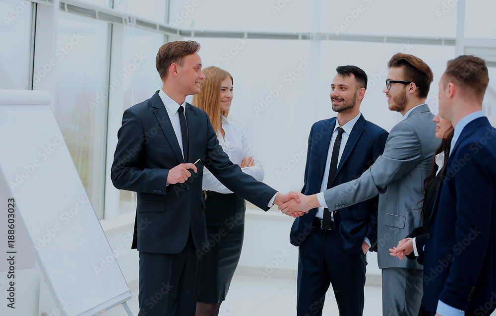 Successful businessmen handshaking after presentation. Successful businessmen handshaking after presentation.
