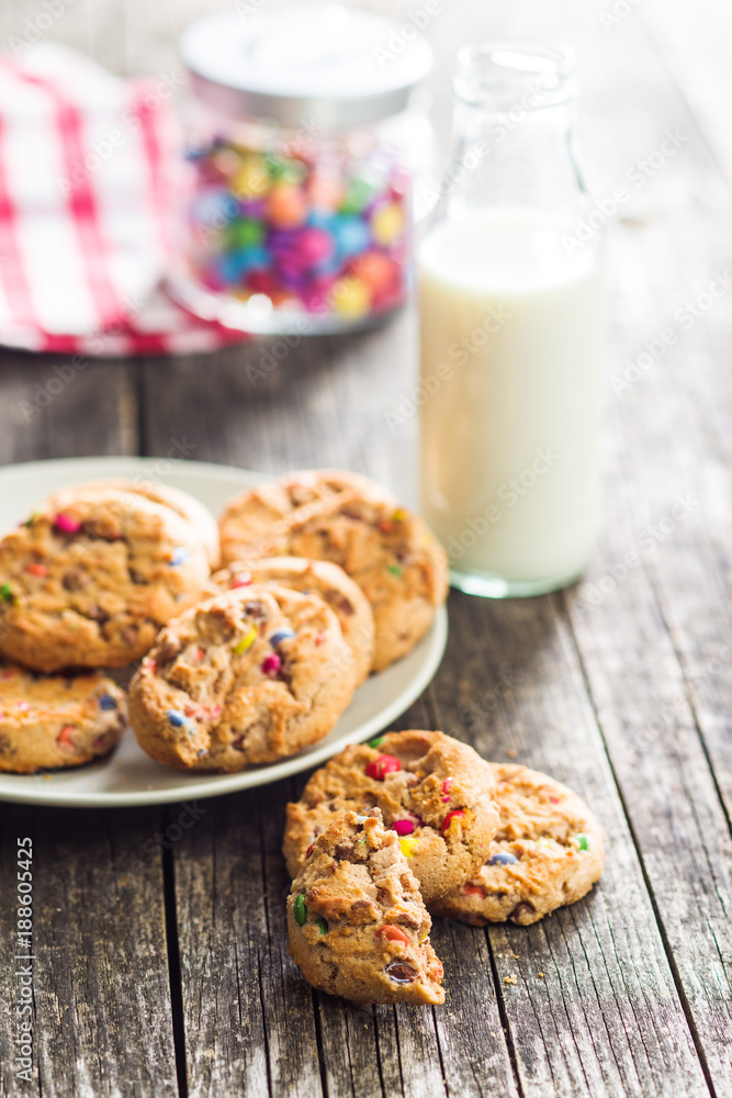 Sweet cookies with colorful candies and milk. Sweet cookies with colorful candies and milk.
