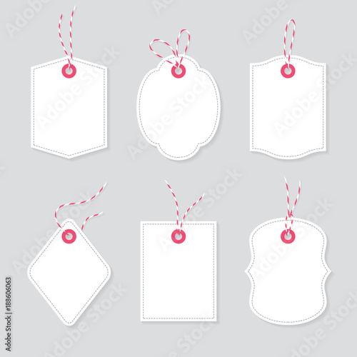 Blank price tags and gift cards tied up with baker twine bows and ribbons set. Paper labels of different shapes