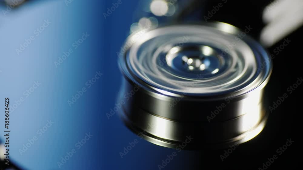 The drives begin to spin inside the disk drive. Date center and information storage concept The drives begin to spin inside the disk drive. Date center and information storage concept