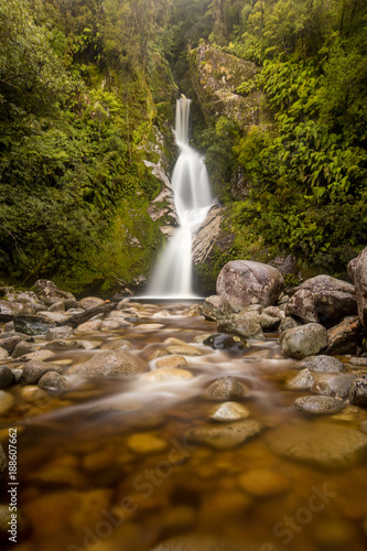 Fototapeta Naklejka Na Ścianę i Meble -  A Long exposure of a New Zealand Waterfall on the West Coast