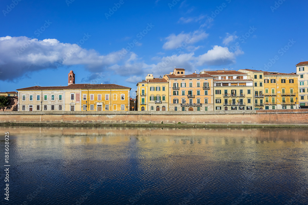 Picturesque Arno River embankment with colorful old houses in Pisa. Pisa, Tuscany, Italy, Europe.