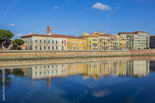 Picturesque Arno River embankment with colorful old houses in Pisa. Pisa, Tuscany, Italy, Europe.