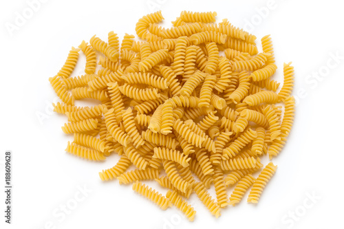 Uncooked fusilli pasta isolated white background.