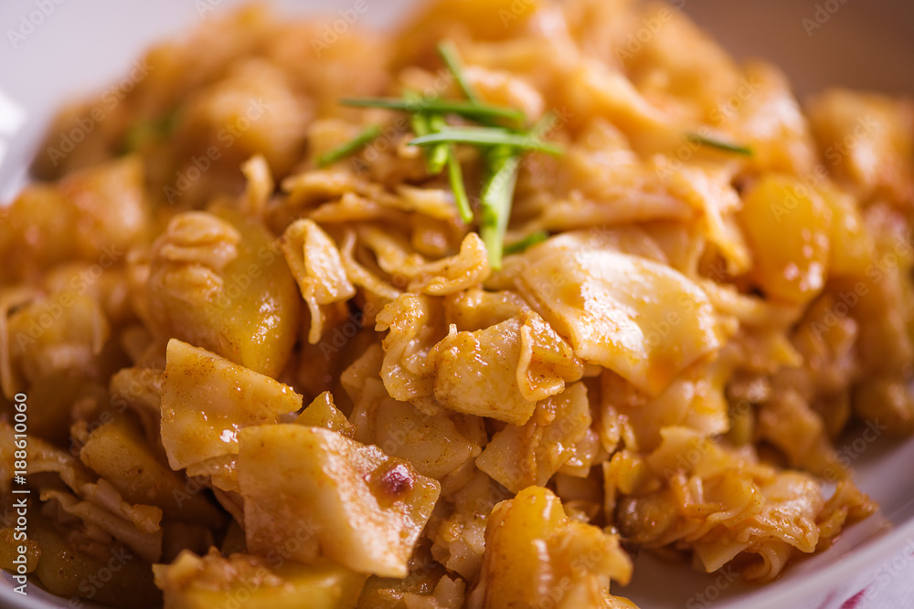 close up detail of eastern european traditional rustic dish from square pasta and cabbage close up detail of eastern european traditional rustic dish from square pasta and cabbage