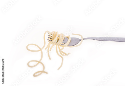 spaghetti on fork on white background