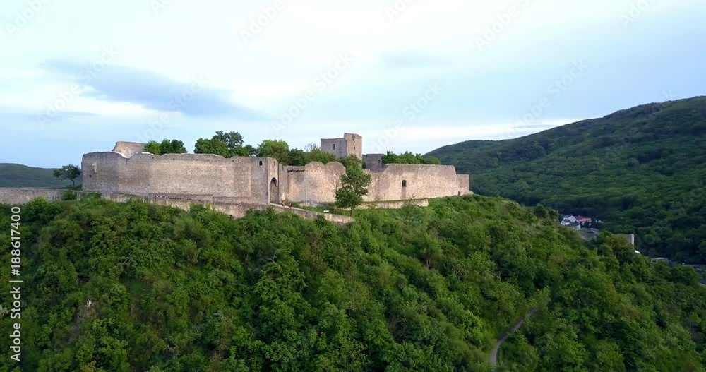 Beautiful scenery around Hainburg, Austria with the camera slowly moving to the right around the fortress Schlossberg with tourists walking inside the stone walls of this ruin. Beautiful scenery around Hainburg, Austria with the camera slowly moving to the right around the fortress Schlossberg with tourists walking inside the stone walls of this ruin.
