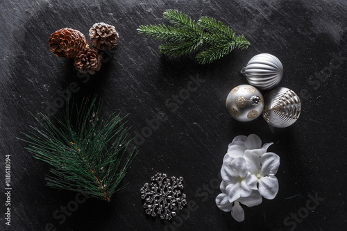 Holiday decorations on slate background