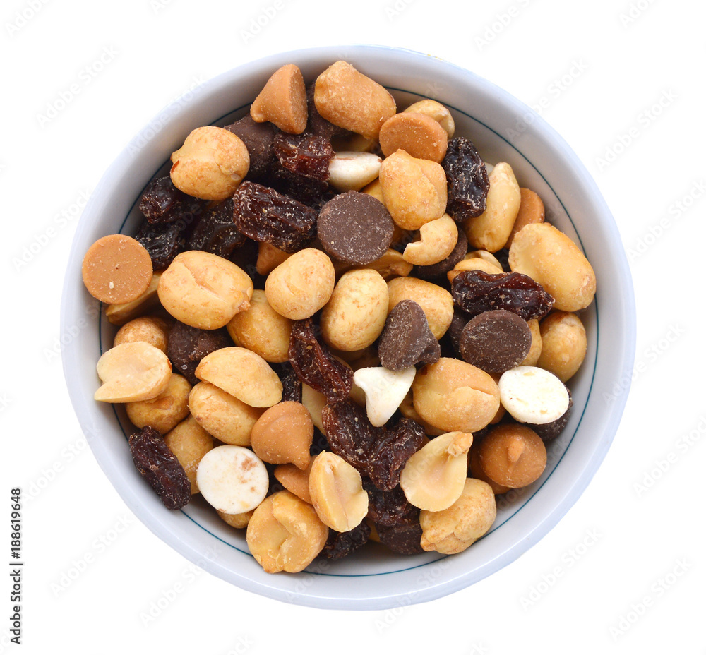 Mix nuts, dry fruits and grapes in white bowl on a white background Mix nuts, dry fruits and grapes in white bowl on a white background