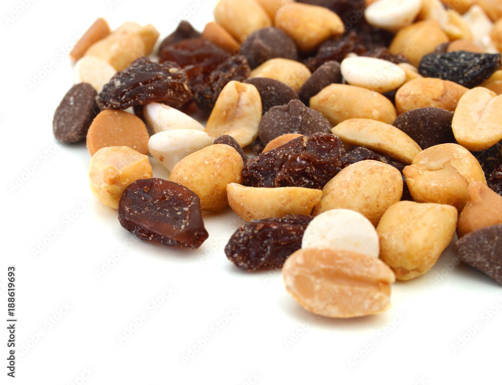 Fototapeta premium Mix nuts, dry fruits and grapes on a white background