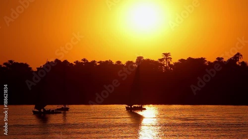 Feluccas & Tourist Boats At Sunset; River Nile Luxor; River Nile, Luxor, Egypt