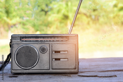 radio vintage pace on old wood,The backdrop is a field. photo