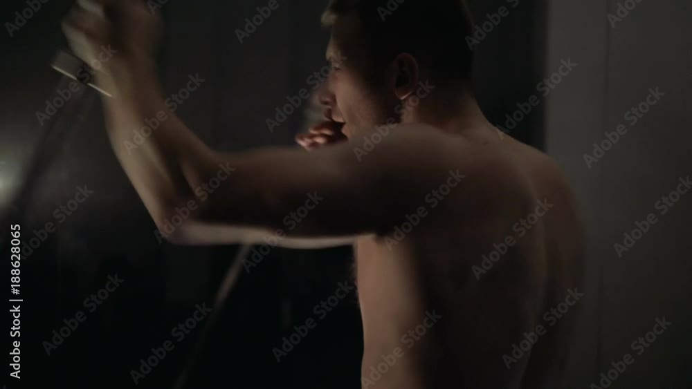 A young man is training. Training in the gym A young man is training. Training in the gym