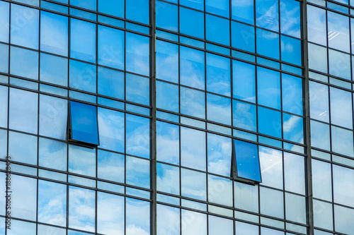 Clouds Reflected in Windows of Modern Office Building.