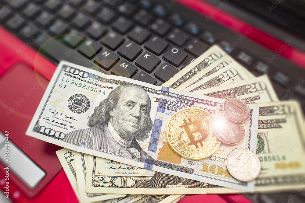 US Dollar for trading concept on laptop with money and coins. Stock market and bitcoin exchanges. Currency trading. US Dollar for trading concept on laptop with money and coins. Stock market and bitcoin exchanges. Currency trading.