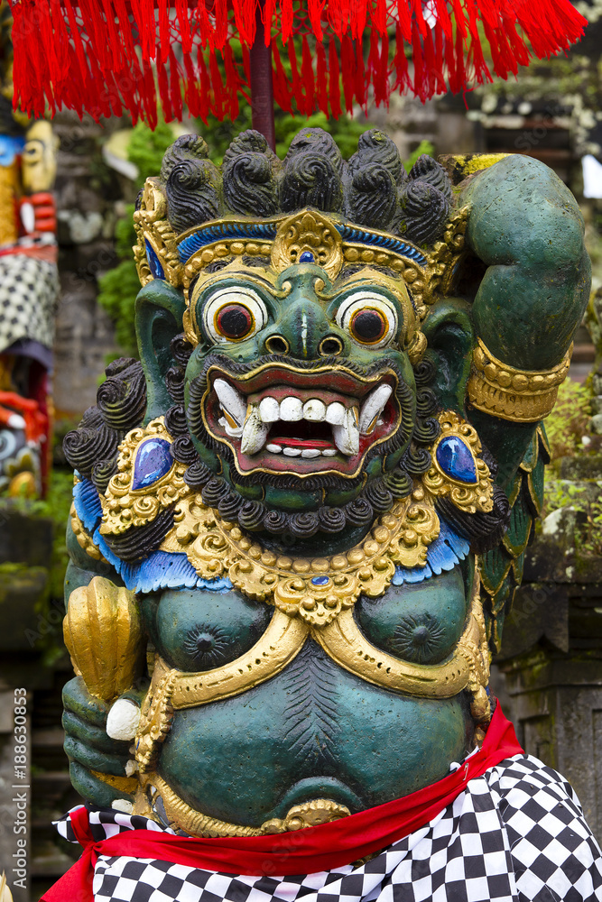 Traditional Balinese statue of Barong on a street temple in Bali, Indonesia