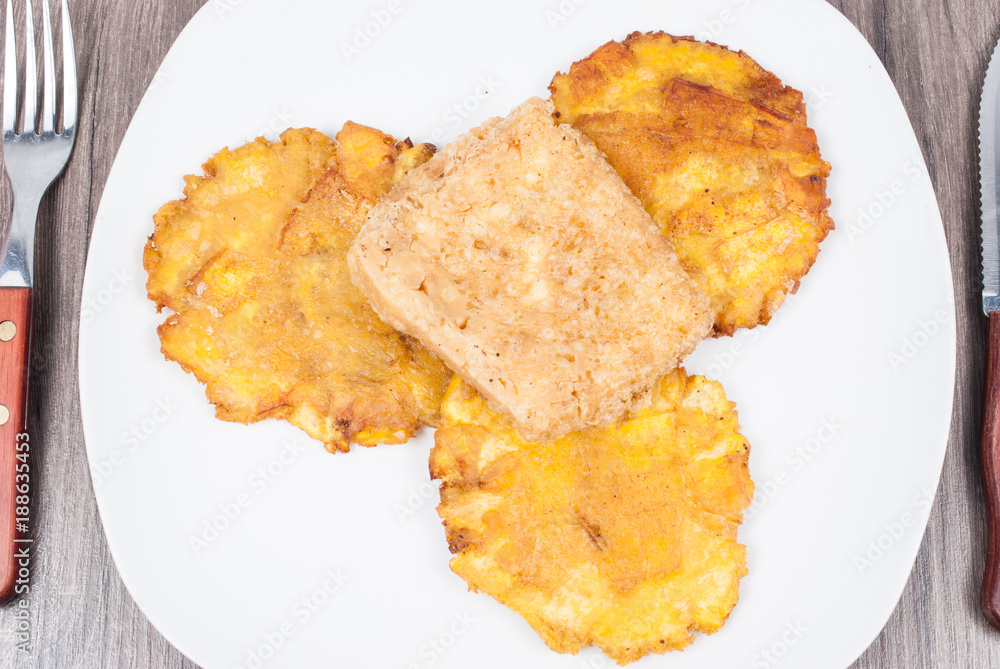 Fried plantain toston (patacon) with fried cheese Fried plantain toston (patacon) with fried cheese