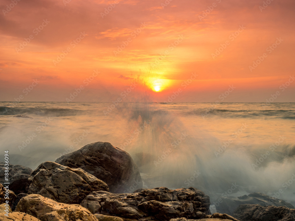 sun rise at the beach with strong wave attack the rock sun rise at the beach with strong wave attack the rock