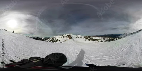 360 video of snow skier, skiing down a mountain.