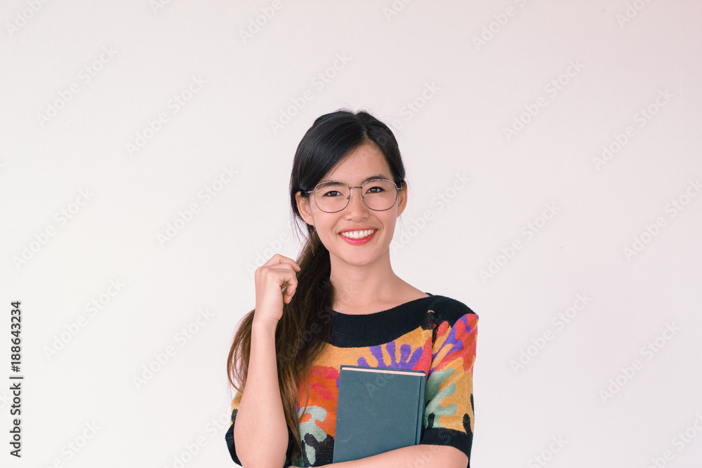 A fashion portrait Young Asian student wearing colourful vintage outfit holding a book A fashion portrait Young Asian student wearing colourful vintage outfit holding a book A fashion portrait Young Asian student wearing colourful vintage outfit holding a book A fashion portrait Young Asian student wearing colourful vintage outfit holding a book