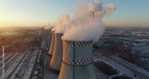 Thermal power station, view from height to pipes, steam from pipes, сogeneration plant aerial view.
