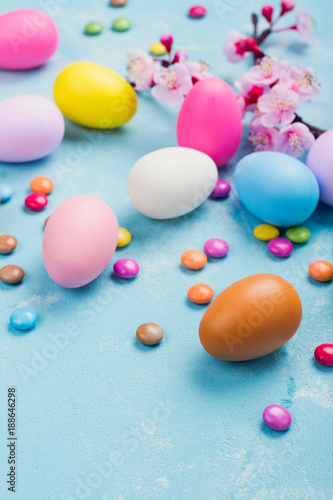 Colorful decorative eggs on spring background