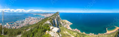 Panorama of top of Gibraltar Rock, in Upper Rock Natural Reserve: on the left Gibraltar town and bay, La Linea town in Spain at the far end, Mediterranean Sea on the right. United Kingdom, Europe. photo