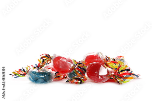 Wrapped candies with transparent cellophane isolated on white background 