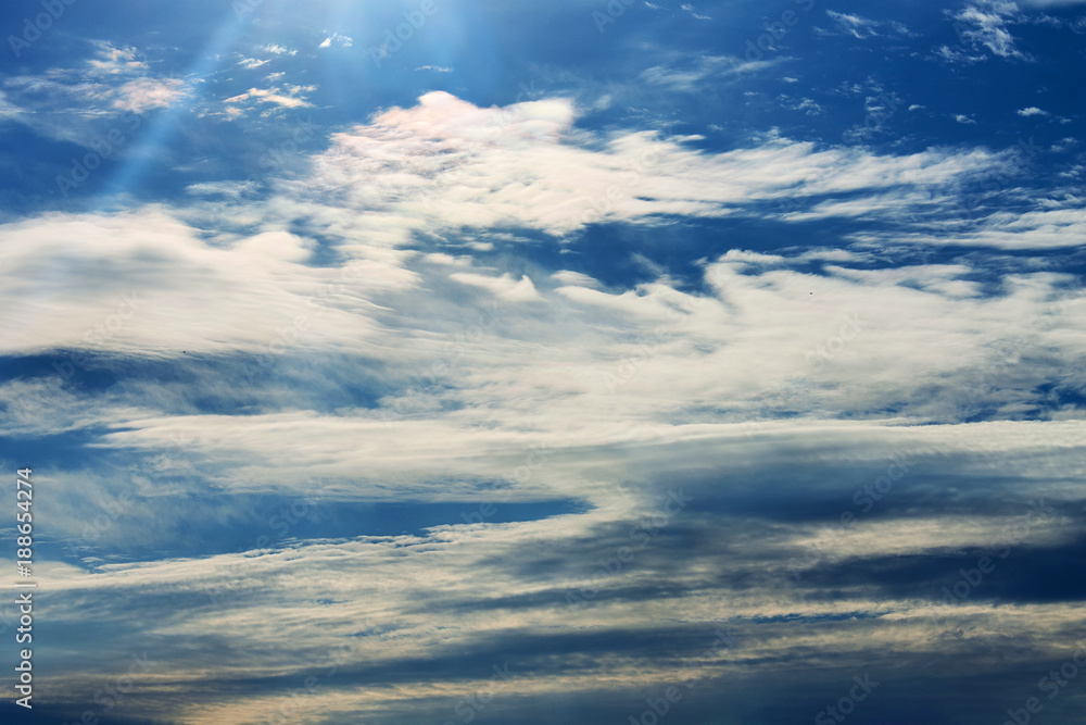 Fototapeta premium Clouds on a blue sky on a sunny day.