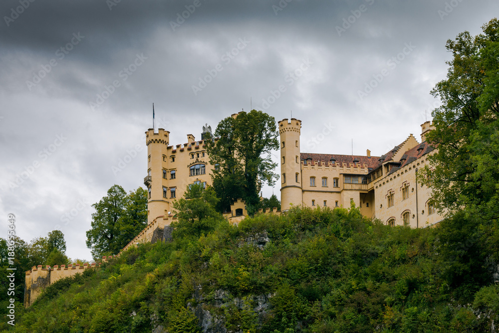 Castle Hohenschwangau in Germany. The Royal Palace in Bavaria. The yellow famous palace is a tourist attraction. 
