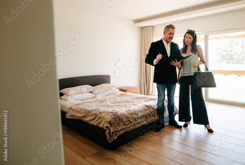 Realtor showing the contract papers to client © Jacob Lund