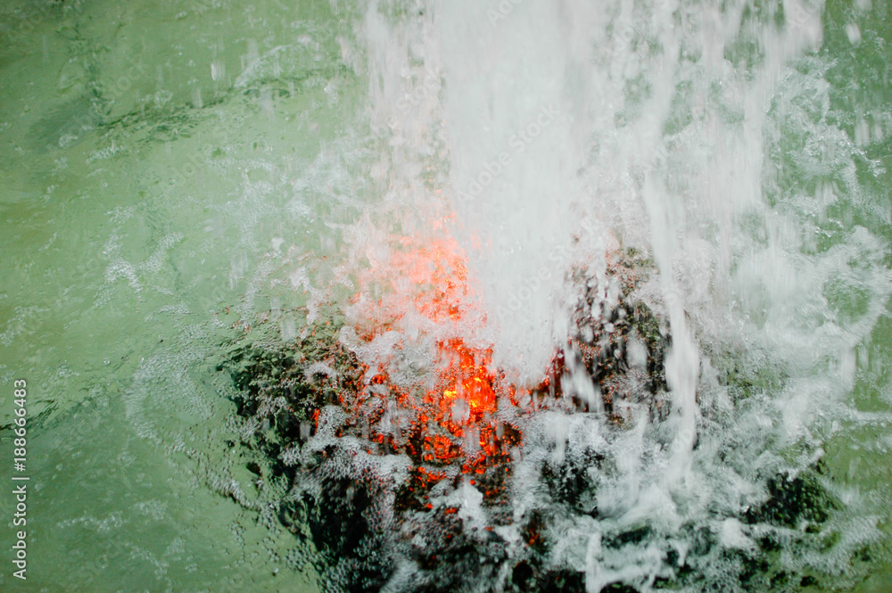 detail of colored fountain with splash of water detail of colored fountain with splash of water