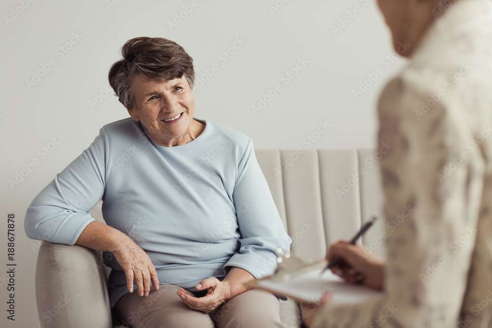 Smiling grandmother and financial counselor Smiling grandmother and financial counselor