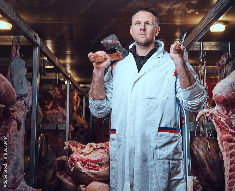 The butcher in a meat factory.