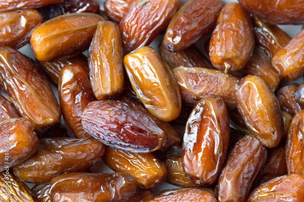 Dry date fruits forming a background Dry date fruits forming a background