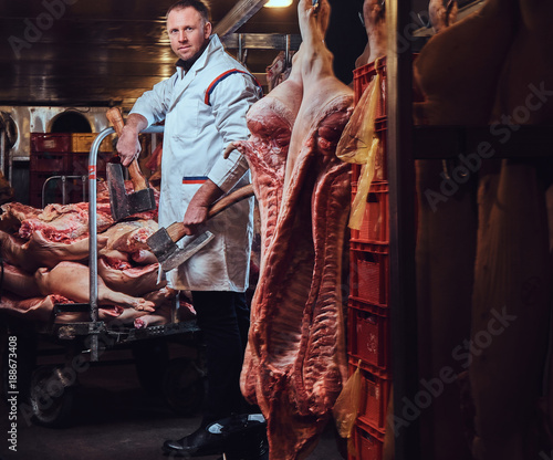 A butcher in a meat factory.