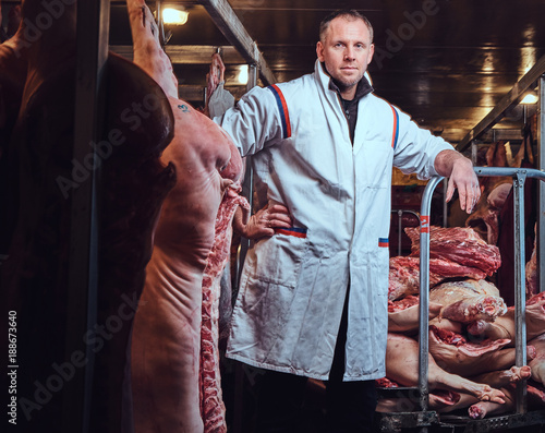 The butcher in a meat factory.