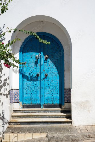 Sidi Bou Said. Tunisia. Houses and streets of the magical white city. ancient blue door in oriental style