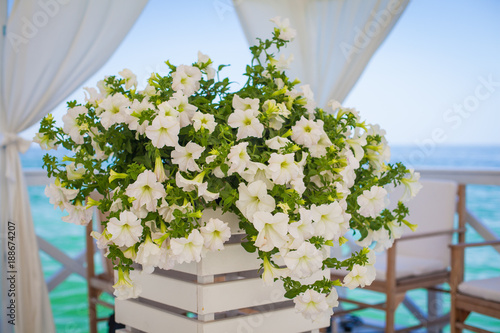 Elegant flower decoration on the table in restaurant for an event party or wedding table photo