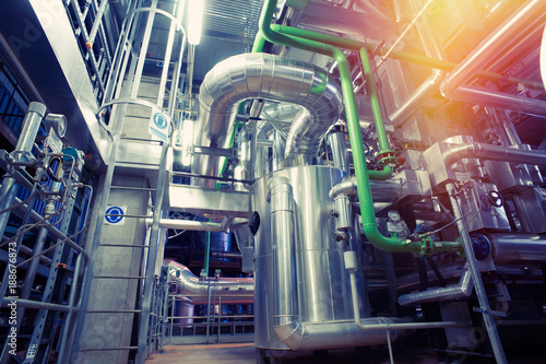 Equipment, cables and piping as found inside of a modern industrial power plant